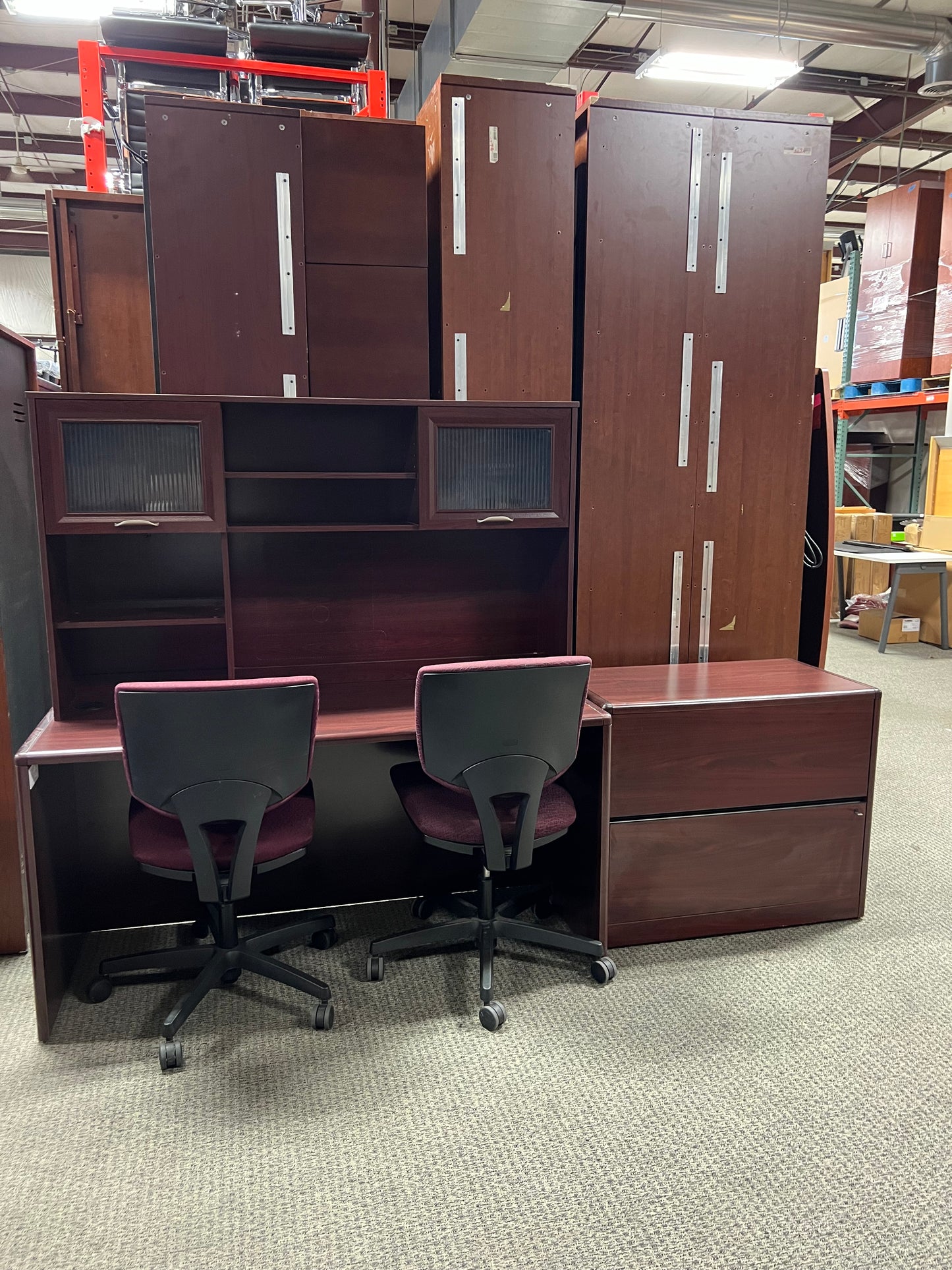 Desk: Cherry laminate desk with attached hutch with glass doors