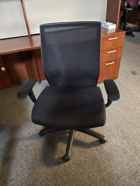 Chair: Big and Tall Task chair. Black mesh back with black fabric seat