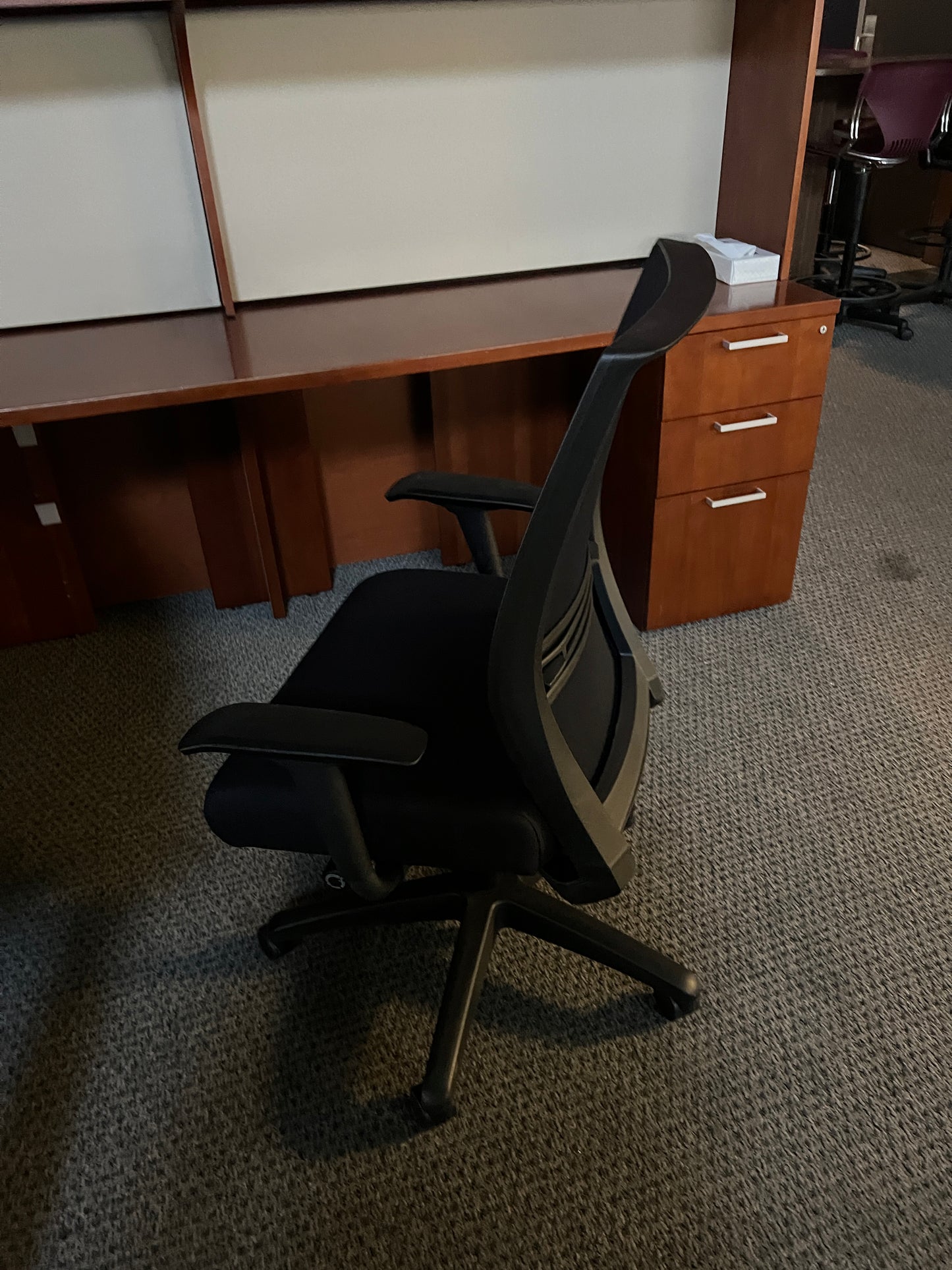Chair: Big and Tall Task chair. Black mesh back with black fabric seat