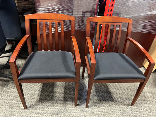 Chairs: Stationary side chair Dark wood frame, black seat