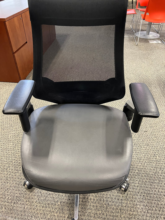 Chair: Desk chair on casters. Mesh back with gray leather seat