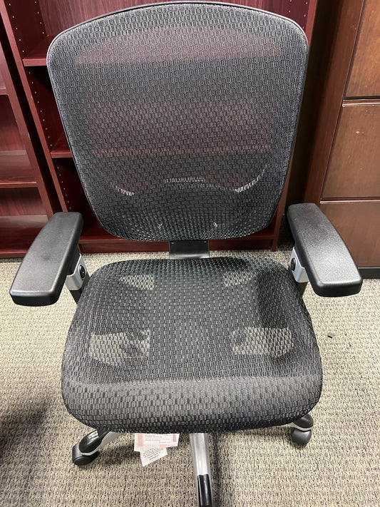 Chairs: Black mesh office chair on casters