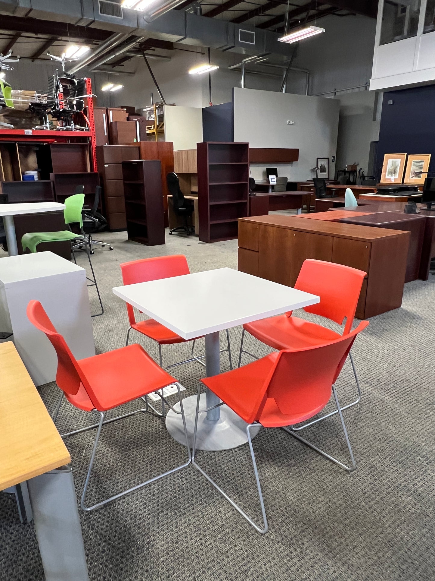 Tables: Haworth square table with orange molded chairs