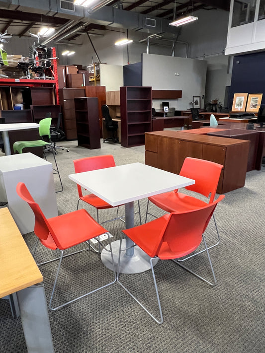 Tables: Haworth square table with orange molded chairs