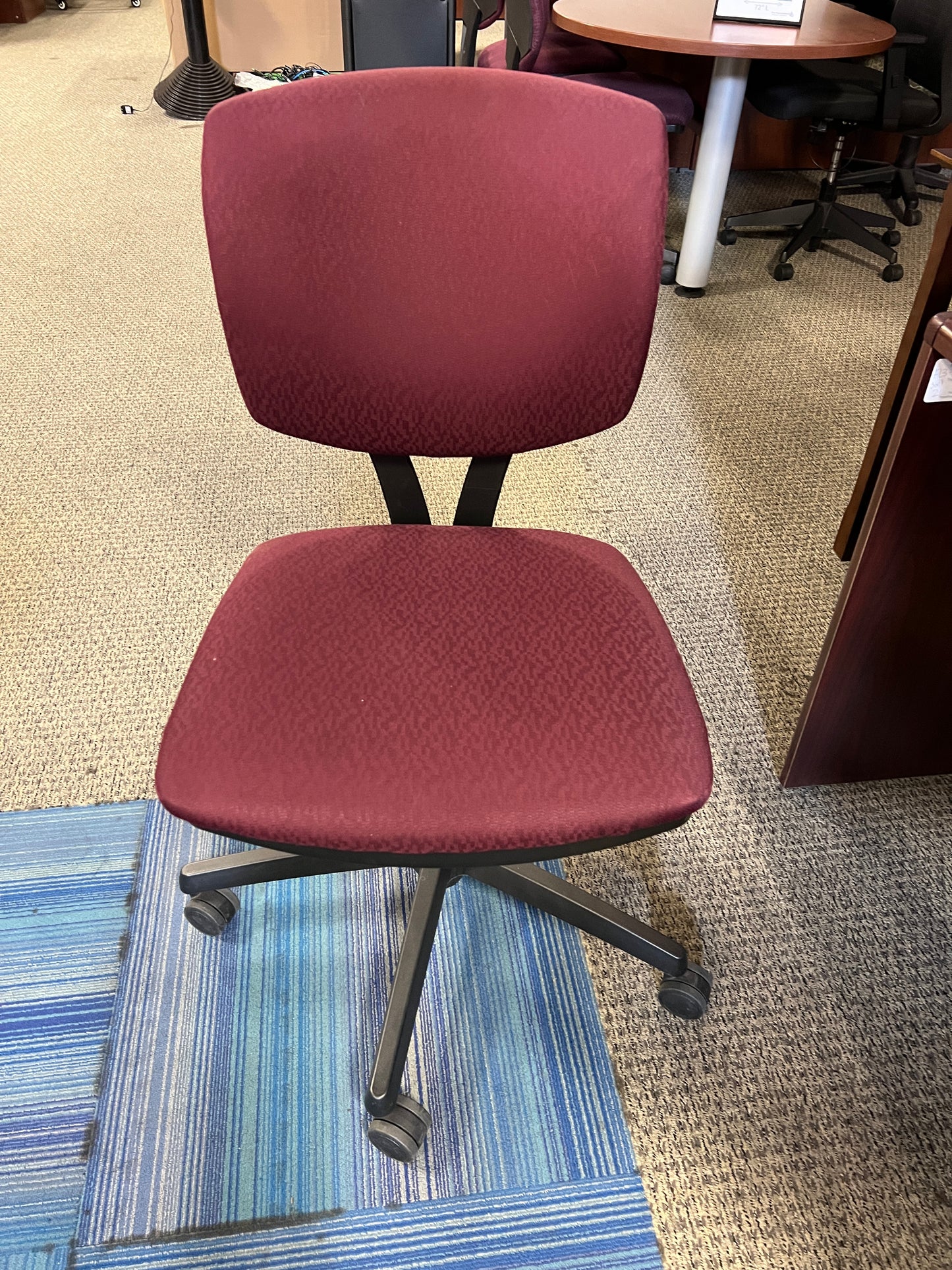 Chairs: Deep red task chair on casters