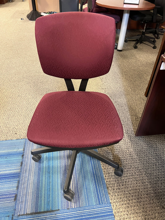 Chairs: Deep red task chair on casters